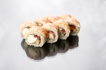 Sushi Rolls with shrimp, crab meat and Cream Cheese on white background isolated. Philadelphia roll sushi with shrimp. Sushi menu.