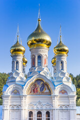Fototapeta na wymiar Front facade and towers of the Russian church in Karlovy Vary