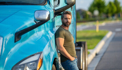hispanic man posing in front of truck. Semi trucks vehicle. man driver near lorry truck. man driver...