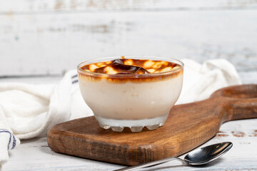 Rice pudding. Fresh delicious rice pudding on a white background. Mild dessert with milk and rice....