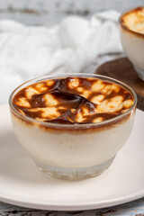 Rice pudding. Fresh delicious rice pudding on a white background. Mild dessert with milk and rice. Traditional Turkish cuisine delicacies. Local name sutlac