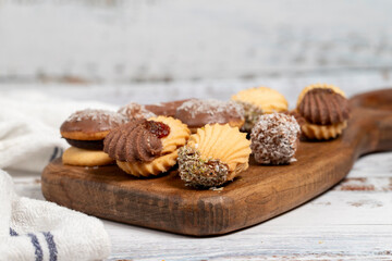Obraz na płótnie Canvas Types of cookies. Assortment of fresh delicious patisserie cookies on a white background