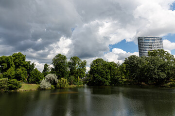 Landscape with lake, trees and clouds