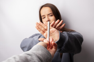 stop nicotine, teenager breaks a cigarette, refusal of smoking of minors