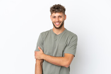 Obraz premium Young caucasian handsome man isolated on white background laughing