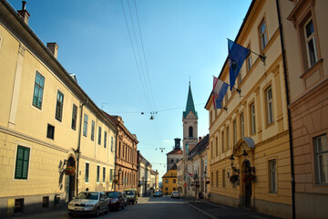Fototapeta premium View from Ćirilometodska Ulica (Street) to the Greek Catholic Co-Cathedral of Saints Cyril and Methodius and Lotrščak Tower in Zagreb Upper Town