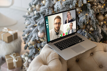 Family video call by remote chat laptop computer screen on Christmas holiday background. Xmas online virtual family party celebration, Happy New Year videocall.