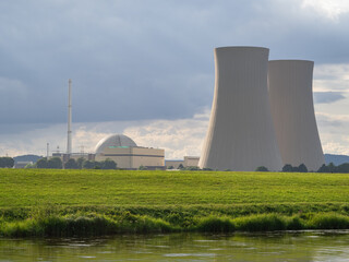 Green landscape and nuclear power plant .