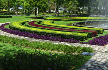 The fountain is a beautiful fountain. in the lawn garden
