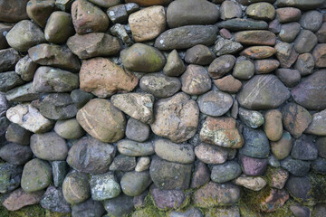 large pebble stone wall texture and background.