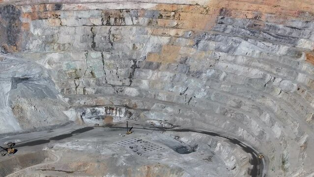 Aerial open pit copper gold mine Ely Nevada 1 pull. Boom town along historic Pony Express trail. Rural mining community. Ore transported to Japan for smelting. Precious minerals.