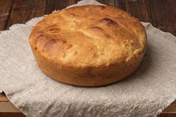 loaf of bread on a wooden board