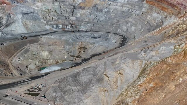 Aerial open pit copper gold mine Ely Nevada 1 slide. Boom town along historic Pony Express trail. Rural mining community. Ore transported to Japan for smelting. Precious minerals.