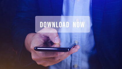Businessman pressing button download now on smartphone virtual screens, business, technology, internet and networking concept.