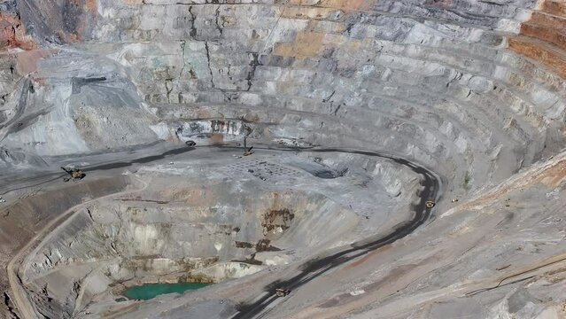 Aerial open pit copper gold mine Ely Nevada 2 pull. Boom town along historic Pony Express trail. Rural mining community. Ore transported to Japan for smelting. Precious minerals.