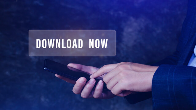 Businessman pressing button download now on smartphone virtual screens, business, technology, internet and networking concept.