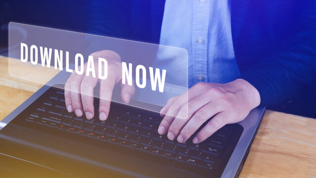 Businessman pressing button download now on virtual screens, business, technology, internet and networking concept.