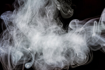 Beautiful white smoke with natural pattern on black background with charming pattern