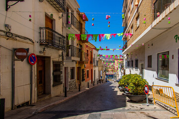 nnarrow streets of the old town in Calpe Spain on a summer hot holiday day