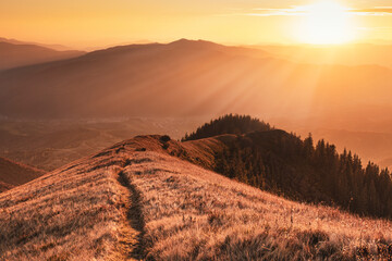 Beautiful mountain trail at the sunset