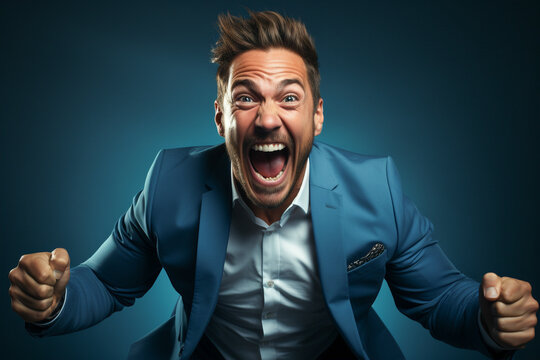 Excited businessman celebrating success keeping mouth open spreading hands isolated on solid color background studio portrait.