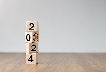 2024 Happy New year background banner. 2023 on wooden block cube for preparation new year change...