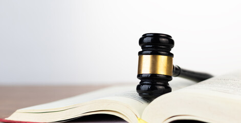 Justice and law concept. Judicial expertise wooden gavel on Law or Legal Book , Symbolizing Justice...