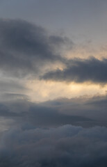 Fototapeta na wymiar Sunset sky with majestic black clouds floating around.