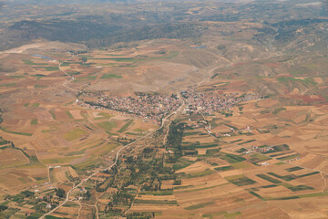 Top view of fields stretching on the steppe and a Turkish village in the steppe around Ankara,...