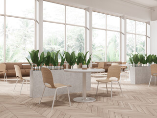 White restaurant corner with sofas and windows