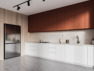 Orange and wooden kitchen corner with cabinets and fridge