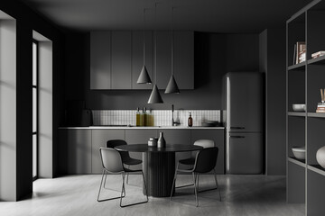 Gray kitchen with round dining table and fridge