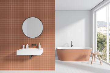 Fototapeta na wymiar Tile bathroom interior with tub and sink with accessories, panoramic window