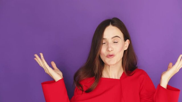 Surprised girl face. Close up of shocked woman face expression. Wow woman emotion on purple background. Amazed model face. Shock girl face expression, spread hands.