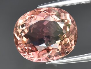 Natural gem pink tourmaline on gray background