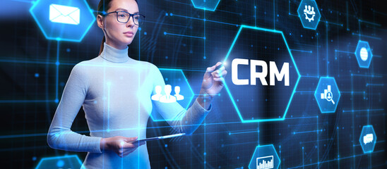CRM Customer relationship management software system business technology concept. Young business woman pressing button on virtual screen.