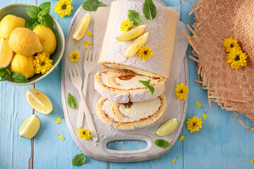 Homemade mango swiss roulade as summer cake.