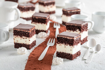 Sweet cream filled pie with cream and dark biscuit.