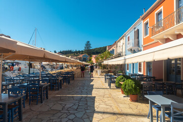 Fototapeta na wymiar Restaurant area in the port of the village of Fiskardo on the island of Kefalonia, Greece