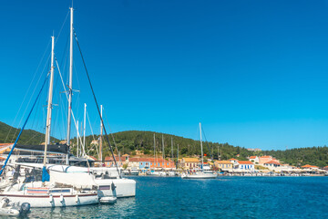 Fototapeta na wymiar Boats in the port of Fiskardo village on the island of Kefalonia, Greece