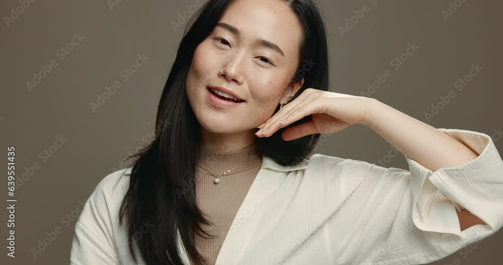 Poster Skincare, smile and asian woman with hand on face in studio for cosmetic, results or wellness on dark background. Beauty, portrait and Japanese female model with glowing skin, results or satisfaction