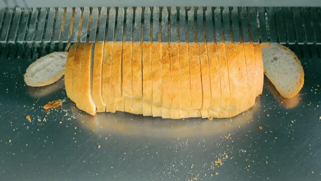 Automatic bread slicer. Slicing bread at the bakery