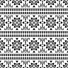 Seamless native stripe pattern. Ethnic geometric abstract motif. Vector illustration in Aztec tribal style. Design for textile template and print fabric. Black and white colors.