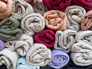 Fototapeta premium pile of colorful fabrics, scarfs