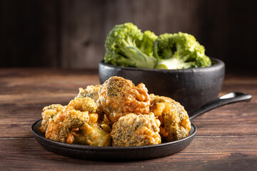 Fried breaded broccoli on the table.