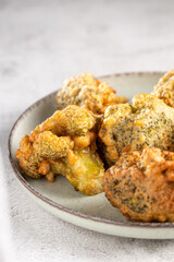 Fried breaded broccoli on the table.