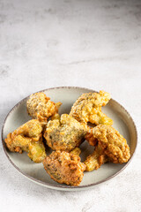 Fried breaded broccoli on the table.