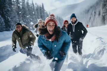 a group of young cheerful diverse men and women posing for a selfie photo on the ski or snowboard vacation in the mountains, having much fun in the snowy terrain