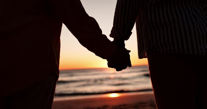 Closeup, holding hands and silhouette with couple at beach for travel, summer vacation and sunset. Relax, support and holiday with man and woman on seaside date for commitment, love and care together