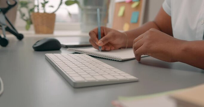 black woman's hands typing on a laptop keyboard. student making notes, girl sitting on chair working online, getting education, studing Slow motion, girl taking part in vebinar, session